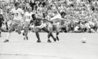 Pele and Jocky Scott go head to head in a tussle during Soccer Bowl 77.