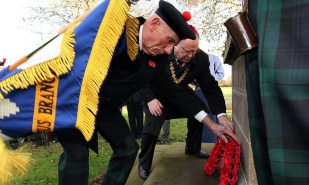 Roland Rose and then Dundee Lord Provost Bob Duncan laid the wreaths at Caird Park war memorial, Dundee.