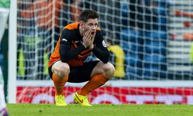 Dundee United midfielder Calum Butcher looks despondent after the Tangerines' League Cup Final defeat at the hands of Celtic in 2015.