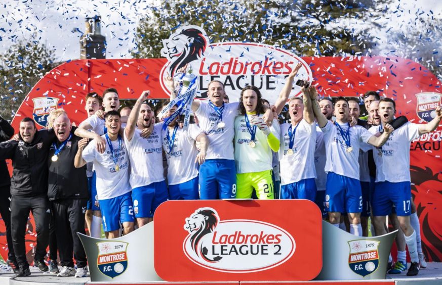 Fleming, centre, was a key part of Montrose's 2018 League Two winning squad