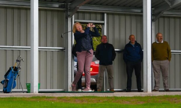 Heather McNiven plays the opening shot at the new range named in honour of her late husband.