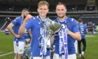 Ali McCann, left, lifting the Betfred Cup with St Johnstone.