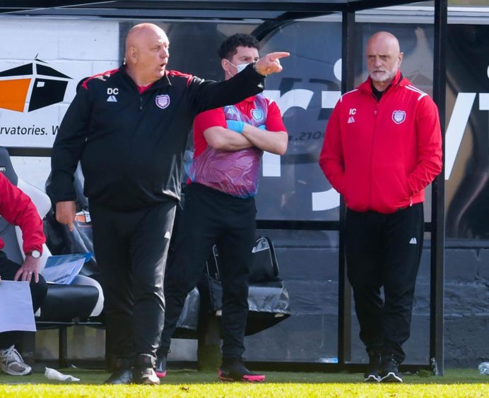 Dick Campbell pointing towards the field as Arbroath manager