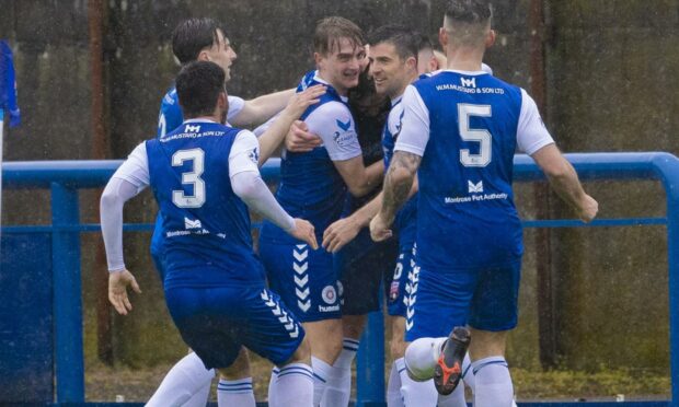 Graham Webster is mobbed by his Montrose teammates after giving his side the lead over Morton in last season's play-offs.