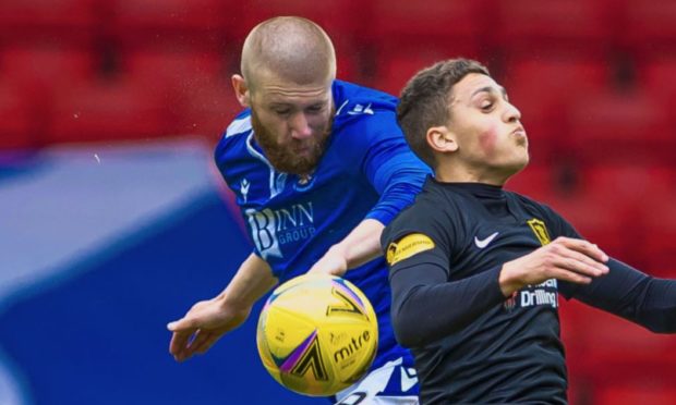 Livingston's Jaze Kabia and St Johnstone's Shaun Rooney in action.