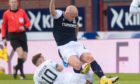 Rovers' Lewis Vaughan challenges Dundee's Charlie Adam.