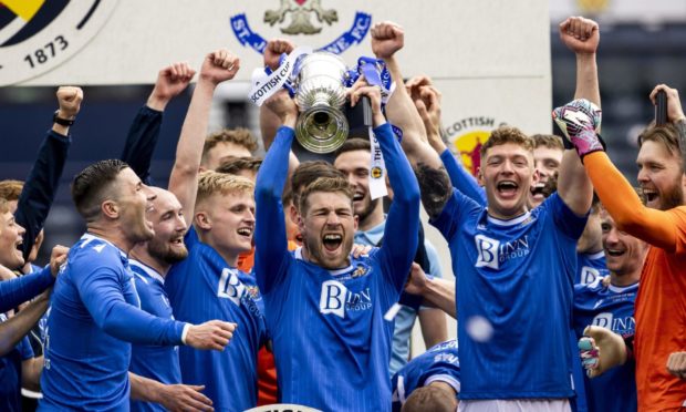 St Johnstone's David Wotherspoon lifts the Scottish Cup after defeating Hibs in the final.