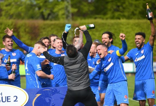 Barry Ferguson celebrates his Kelty side's promotion to the SPFL