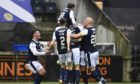Dundee players celebrate.