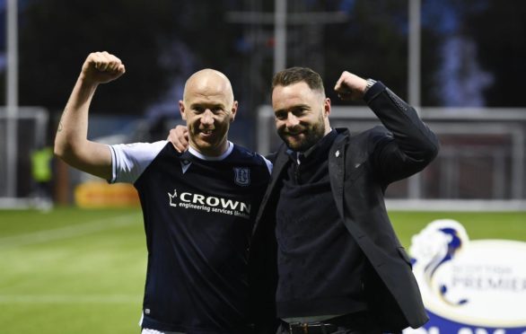 Charlie Adam and Dundee boss James McPake celebrate their side's promotion success