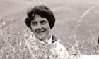 Artist Joan Eardley in a cornfield at Catterline.