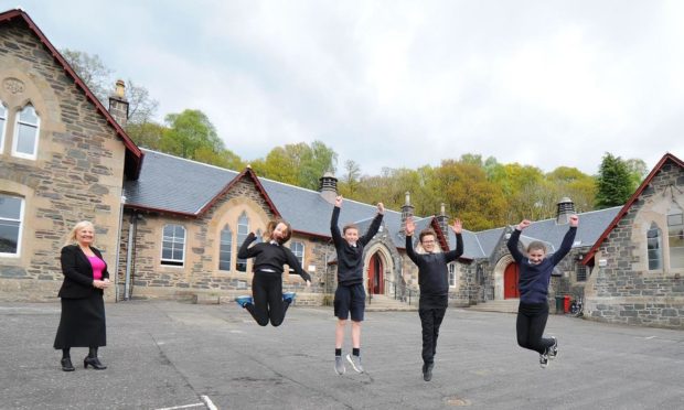 Children outside refurbished Aberfoyle Primary School alongside headteacher Maxine Barwick