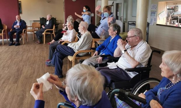Residents of Ancaster House enjoying the performance.