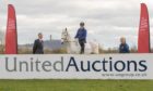 From left: United Auctions' Christopher Sharp, BHS member Shonagh Robb on her horse Platinum Cracker and Helene Mauchlen of the British Horse Society.