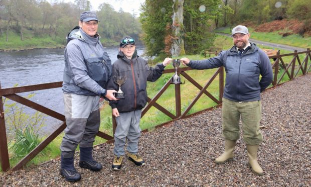 Liam Crees with his father Steve Crees and TGA chairman Cohn O’Dea. Picture: Phil Hannah.