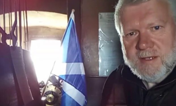 Callum MacLeod performs 'Match of the Day' in the bell tower of Holy Trinity Church, St Andrews