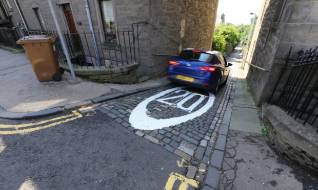 A car driving down Strawberry Bank, Dundee.