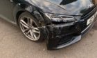 Damage caused to the parked Audi.