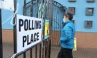 Voters arrive to vote in Dundee.