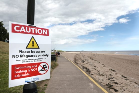 Evening telegraph Broughty Ferry news CR0022313 G Jennings pics, cllr Craig Duncan is highlighting that there is no lifeguards now at Broughty Ferry beach, thursday 9th july.