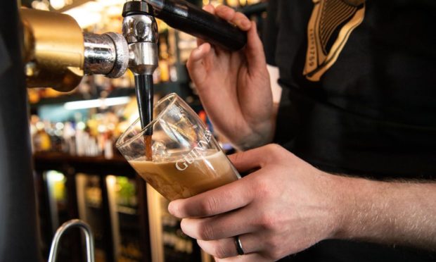 A pint of Guinness being poured as pubs reopen following the winter lockdown.