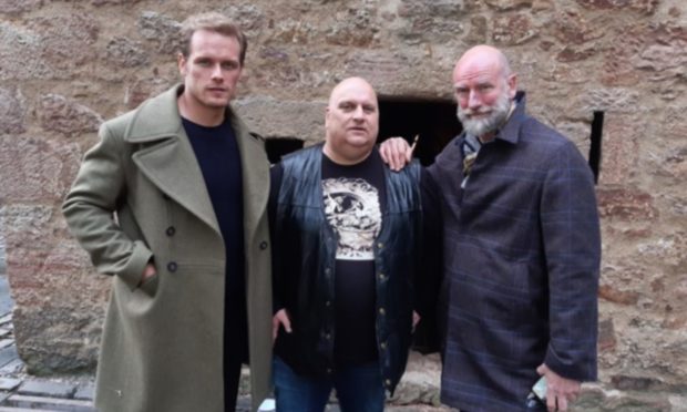 Sam Heughan, Lenny Low and Graham McTavish on set in Crail