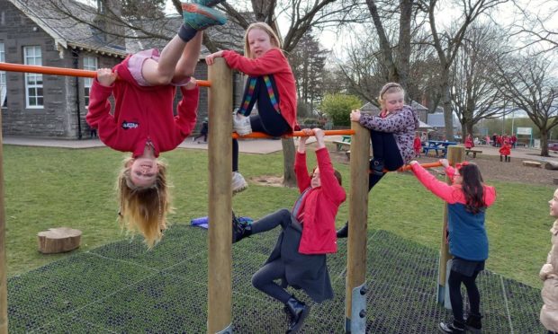 Liff Primary pupils on their new play equipment.