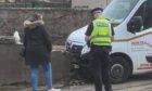 The van crashed into a wall on a Lochgelly street after striking a pensioner.