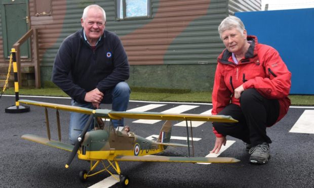 MAHSC chairman Stuart Archibald and Fiona Dawson with the model aircraft.