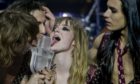 Members of the band Maneskin from Italy kiss the trophy after winning the Grand Final of the Eurovision Song Contest in Rotterdam.