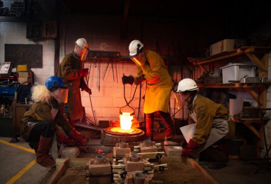 Artists at the Scottish Sculpture Workshop melting and pouring bronze for the institution's 40th anniversary. 
Pictures by JASON HEDGES