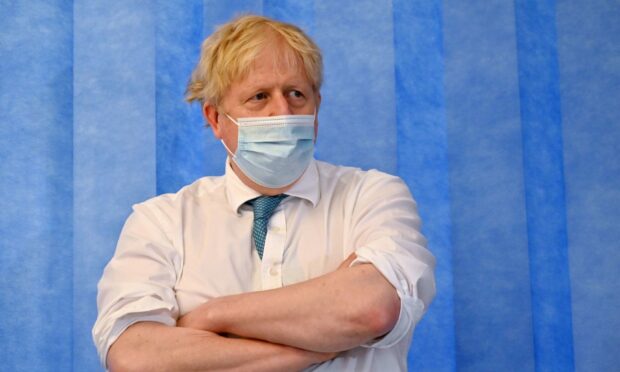 Prime Minister Boris Johnson during a visit to Colchester Hospital in Essex in May.