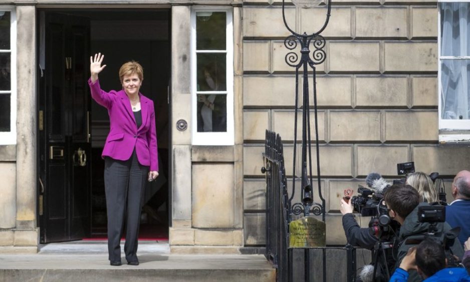 Scottish First Minister and SNP leader Nicola Sturgeon on the steps of Bute House in Edinburgh after the SNP won a fourth victory in the Scottish Parliament election. Picture date: Sunday May 9, 2021. PA Photo. The SNP fell one seat short of an overall majority in the Scottish parliament elections, securing 64 seats, but the final result still leaves Holyrood with a pro-independence majority. See PA story POLITICS Elections Scotland. Photo credit should read: Jane Barlow/PA Wire