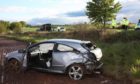 The car ended up in a field following the collision on the A933 on Saturday.