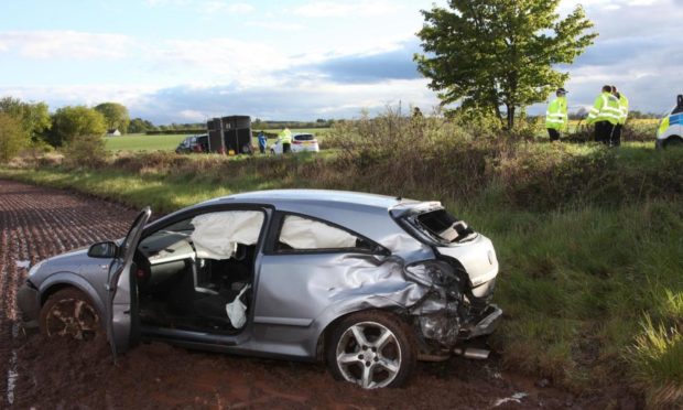 The car ended up in a field following the collision on the A933 on Saturday.