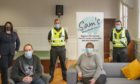 The opening was attended by (back Nicky Connor of Fife Health and Social Care Partnership, Inspector Paul Gillespie and Sergeant Craig Fyall, and (front) Ross Reilly and Susan Neilson from Sam's Cafe.