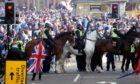 Mounted police watch on as Rangers fans celebrate winning the Scottish Premiership in George Square, Glasgow, after their match against Aberdeen. Picture date: Saturday May 15, 2021. PA Photo. See PA story SOCCER Rangers. Photo credit should read: Andrew Milligan/PA Wire.