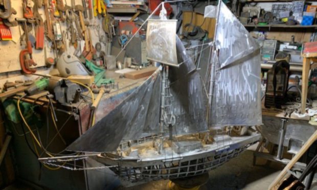 Metal model of the schooner Isabella under construction at the workshop of the 'Stonehaven Banksy'.
