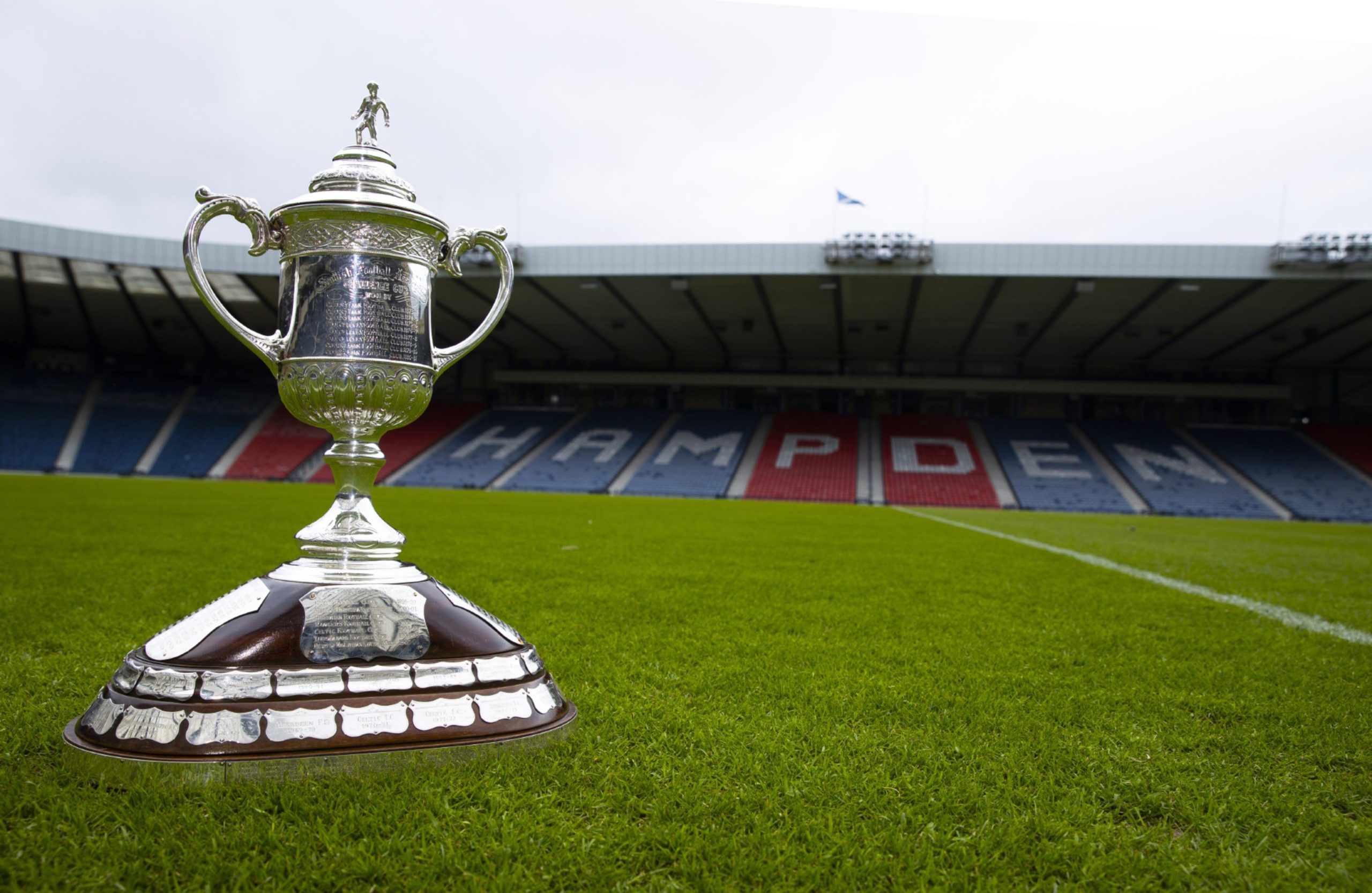 the Scottish Cup sits on the Hampden Park pitch