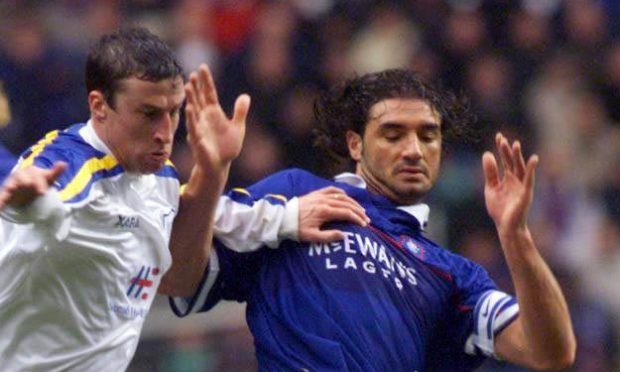 Paul Kane grapples with Lorenzo Amoruso in 1999.