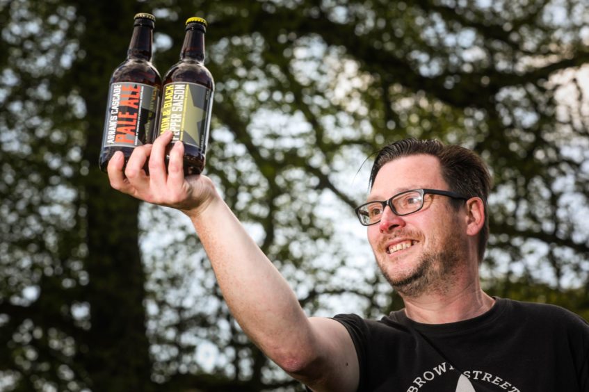 Chris Hainey from Brown Street Brewing Company with some of his craft beers.