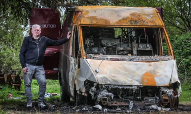 The Courier, CR0028349, News, Jimi Simpson story, David Baikie, the chairman of Tayport Football Club is speaking about on-going anti social problems at the ground, including a van that was torched over the weekend. Picture shows; David Baikie, the chairman of Tayport Football Club, with the van which was set alight on the grounds. Thursday 20th May, 2021. Mhairi Edwards/DCT Media