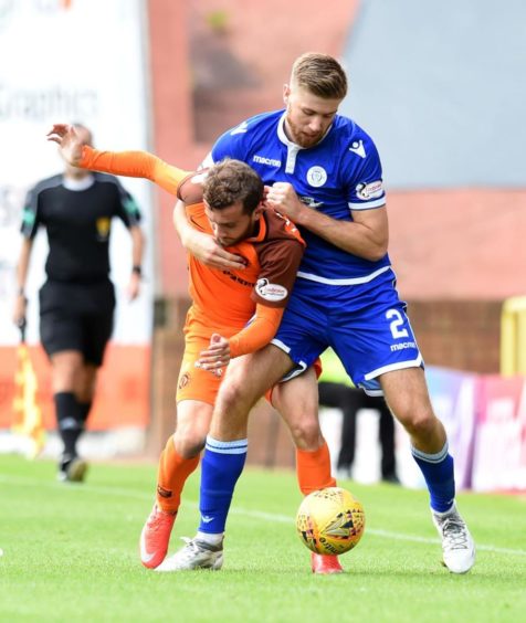 Shaun Rooney of St Johnstone fouling Paul McMullan