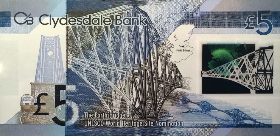 A Scottish £5 bank note featuring images of the Forth Bridge