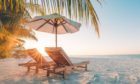 Beautiful beach. Chairs on the sandy beach near the sea. Summer holiday and vacation concept for tourism. Inspirational tropical landscape; Shutterstock ID 633002651; Purchase Order: Health and wellbeing team; Job: How to go on holiday safely; d2b53d12-abac-4853-a82c-4e3e9b3a9542