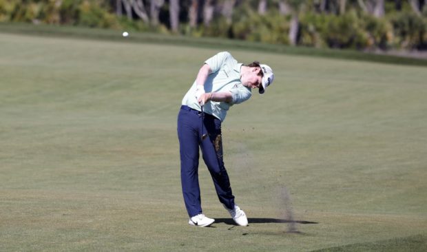 Robert Macintyre of Scotland hits from the fairway at the Ocean Course's 12th hole.