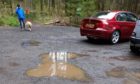 Potholes at the resurfaced Templeton Woods car park
