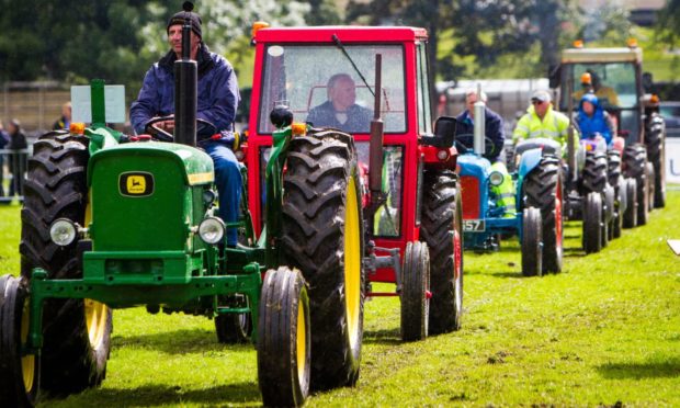 GOOD OLD DAYS: The popular vintage tractor parade in main arena at South Inch.