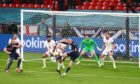 Scotland's Lyndon Dykes  has this shot cleared off the line by Reece James.