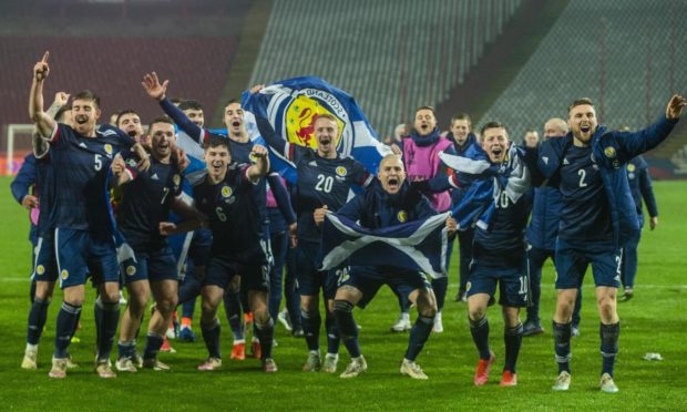 Scotland's players celebrate after David Marshall saves Aleksandar Mitrovic's penalty during the UEFA Euro 2020 play off final defeat of Serbia.